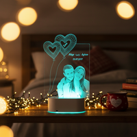 Custom photo 3D LED lamp on bedroom shelf with fairy lights in cozy dark room